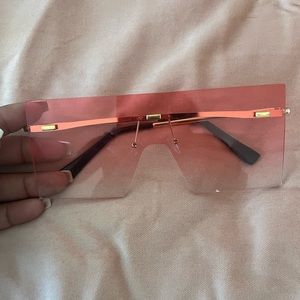 Pink sun glasses.
